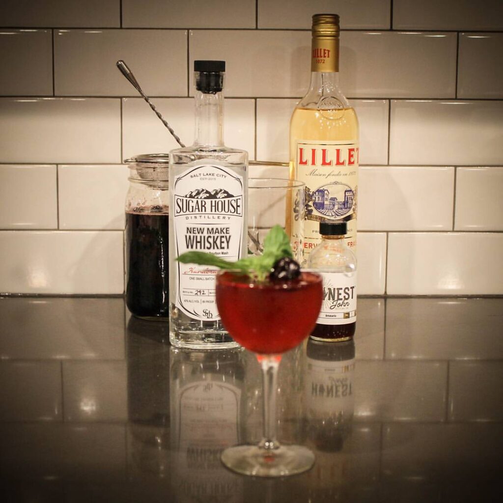 Sugar House Distillery whiskey and lilllet with a pink beverage