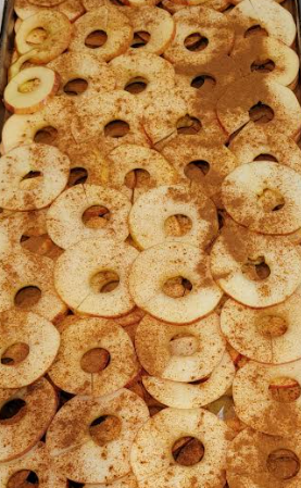 A pan filled with sliced apples on top of a counter