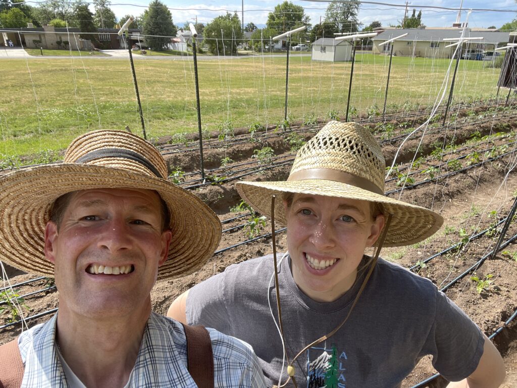 A man and a young boy enjoying a sunny day in a field