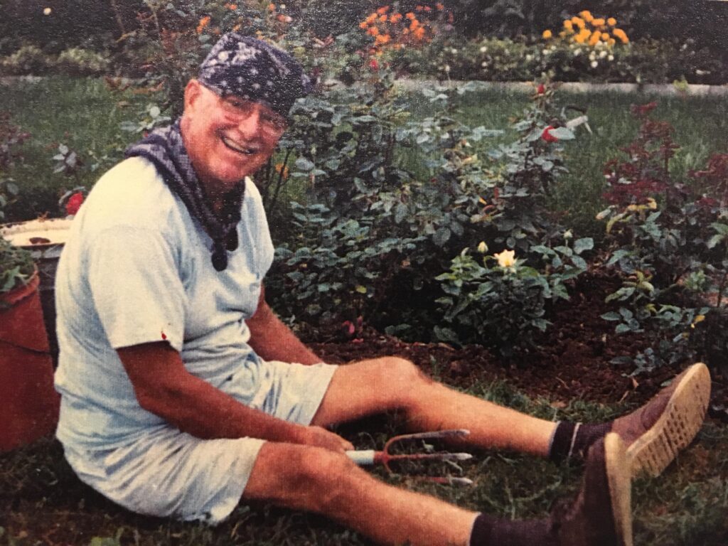 A man sitting on the ground with his legs crossed