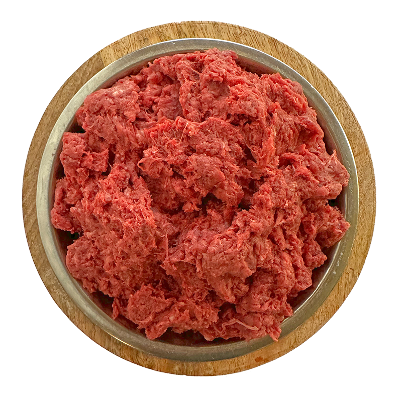 A wooden plate with a bowl of freshly ground beef