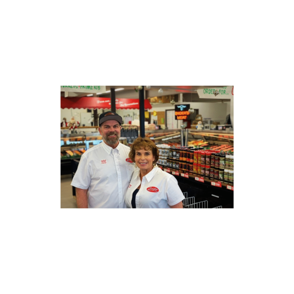 Owners of Snider Bros Meats in storefront