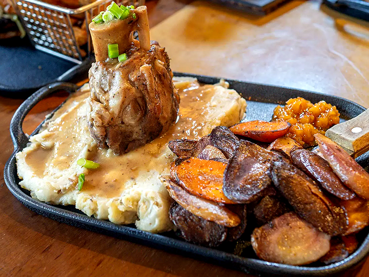 A plate of delicious mashed potatoes and meat