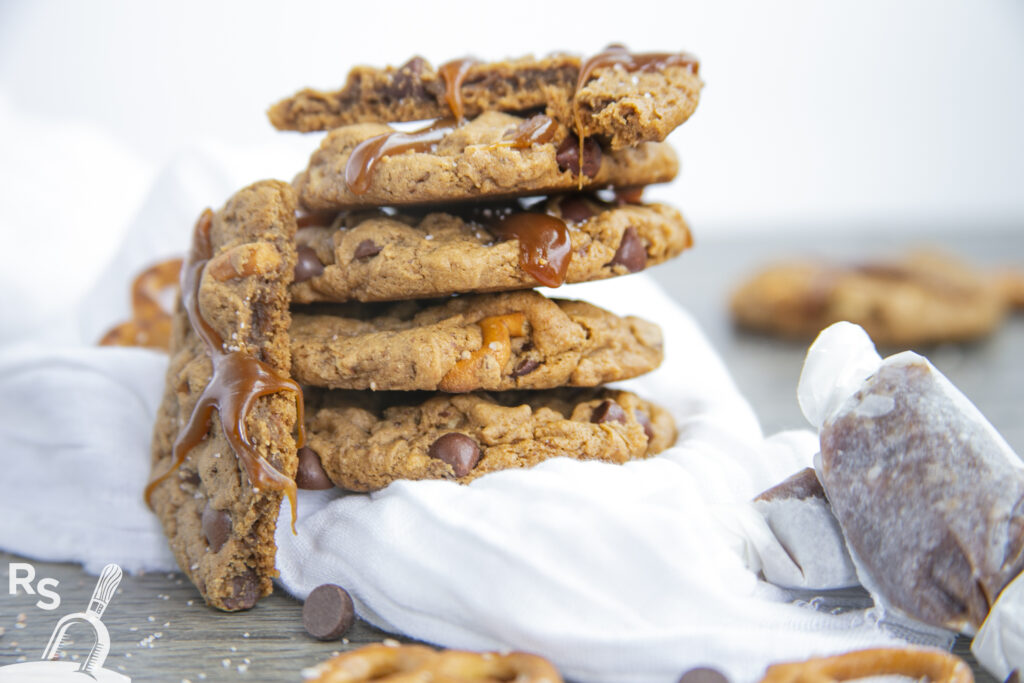 a stack of cookies on a white napkin