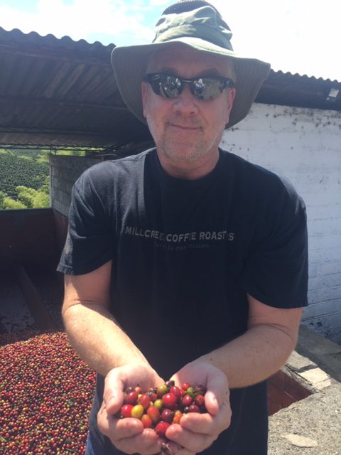 A man holding a handful of fresh berries