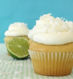 A close up of a cupcake with frosting and a lime